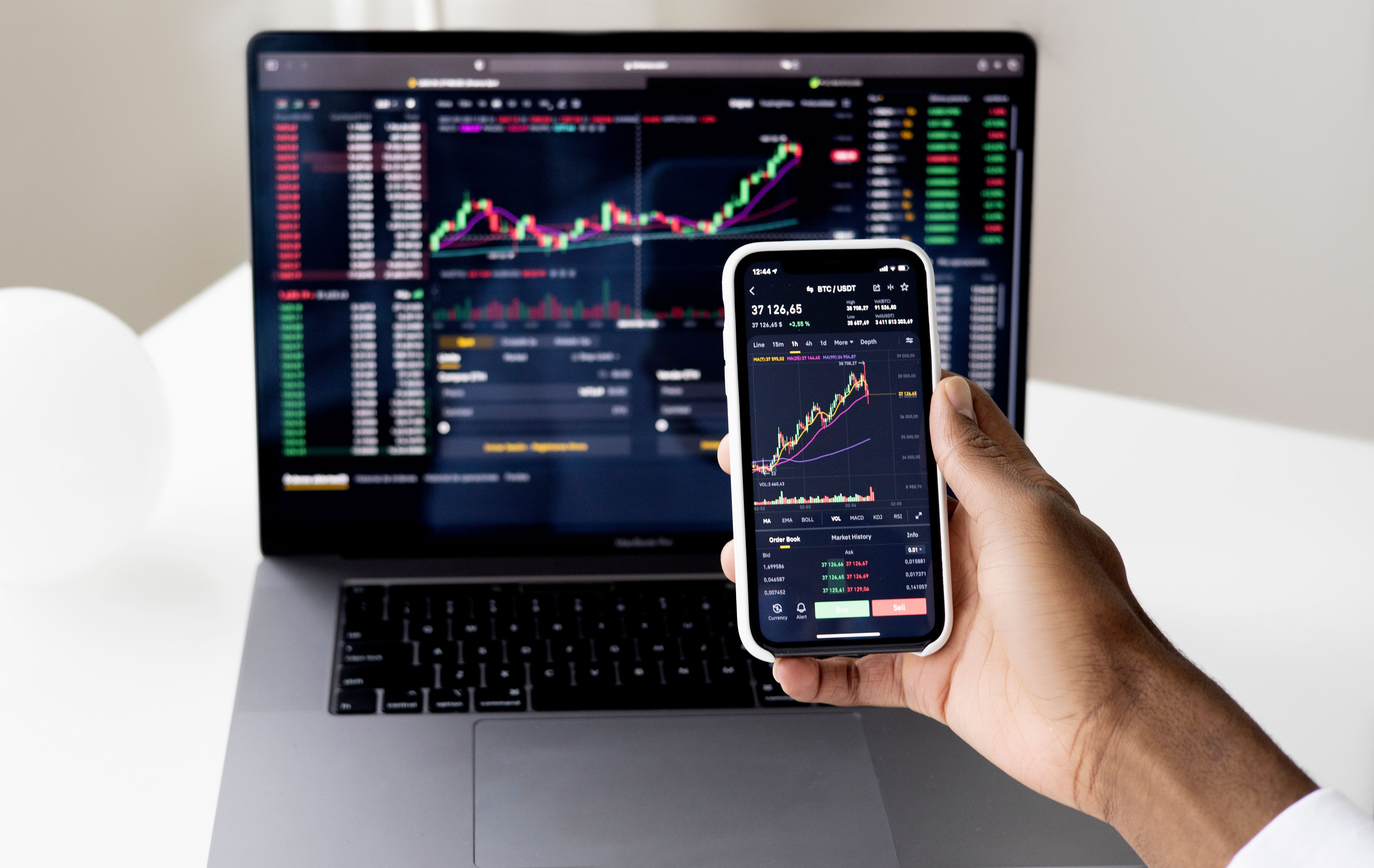Person checking finance app on smartphone